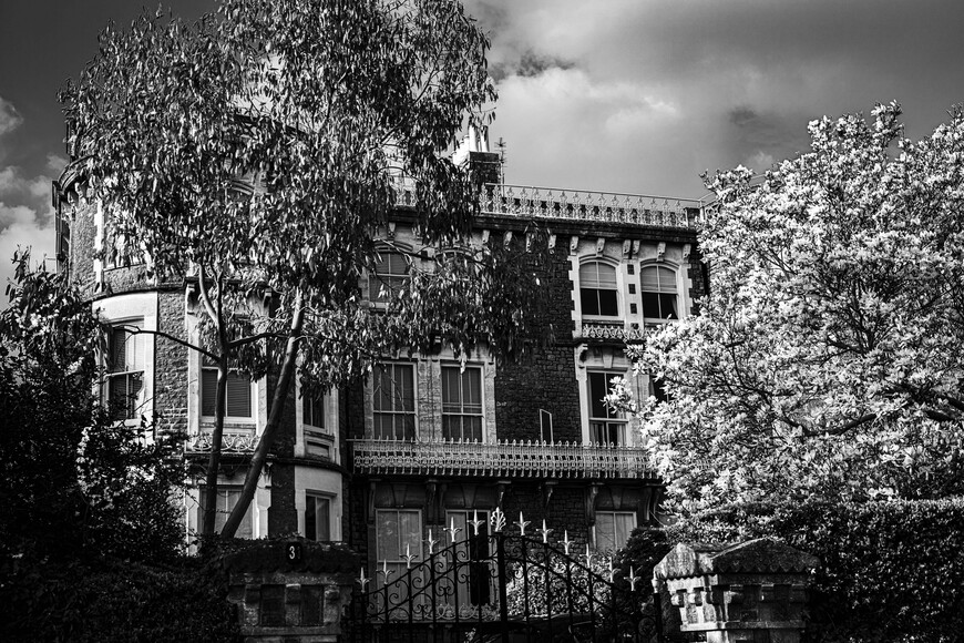 Black and white image of a large townhouse-style property
